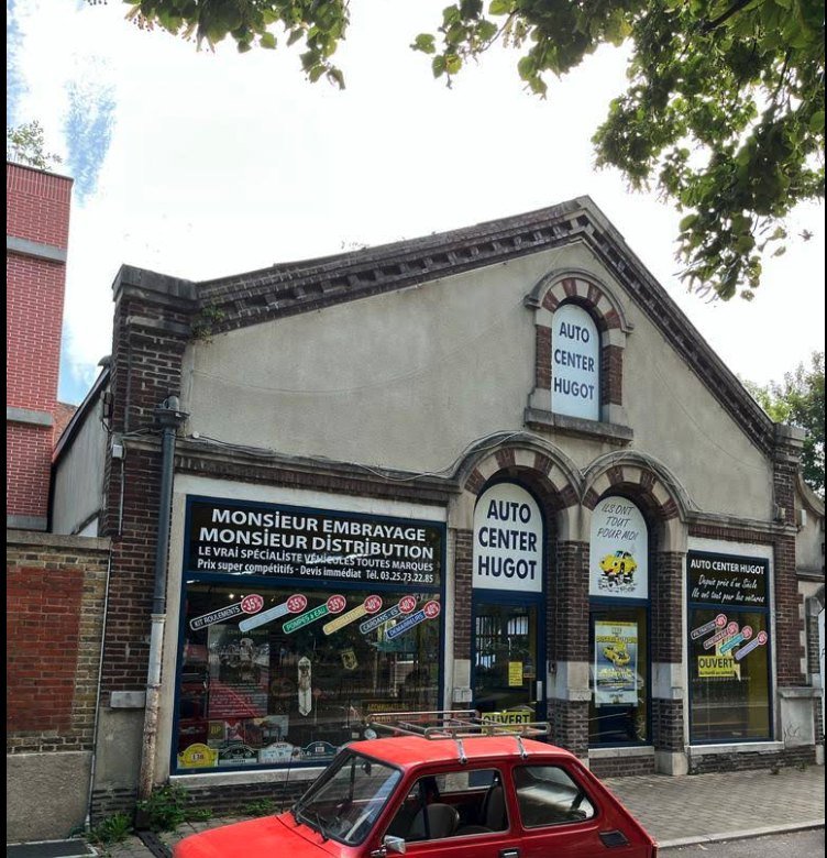 Façade en brique du garage Auto Center Hugot